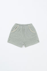 Avauma Pocket Day Shorts in Green Tea Milk – soft green toddler shorts with elastic waistband and scallop pockets on white background